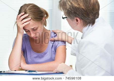 teenage girl suffering with depression in a conversation with a therapist