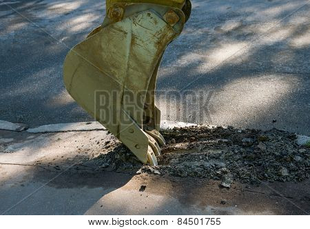 Excavator Bucket Destroys Asphalt.