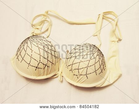 Light Yellow Bra Isolated On The White Background