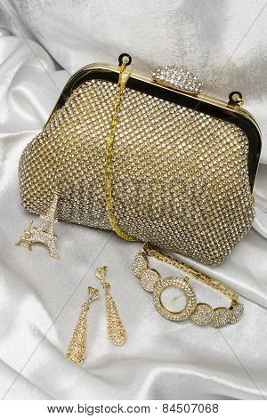 Set Of Women's Accessories On A Silk Background