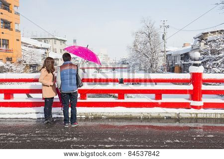 Romantic Scene Of Love Couples Partners At Red Nakabashi Bridge In Takayama, Japan