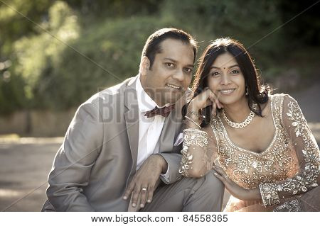 Young in love Indian couple flirting and laughing outdoors