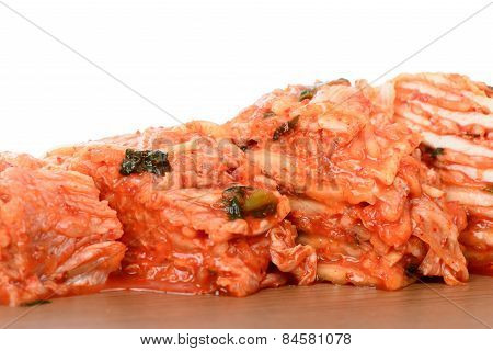 Red Gimchi On A Wooden Plate