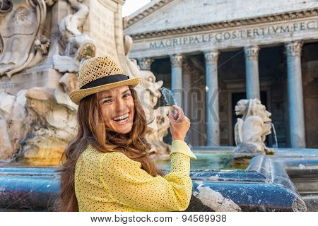 Happy Woman Tourist Preparing Coin To Throw In Pantheon Fountain