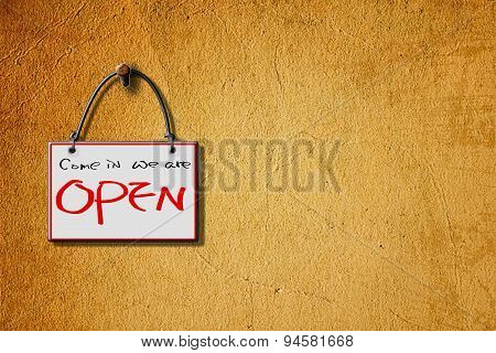 Come In We Are Open Hanging Sign Isolated On Wall