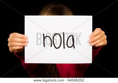 Child Holding Sign With Spanish Word Hola - Hello