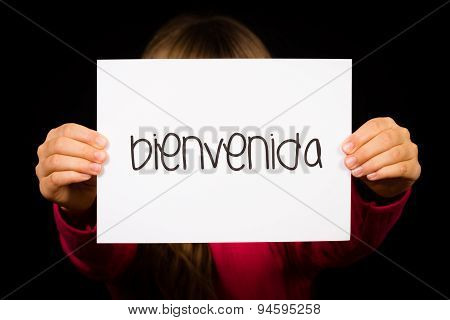 Child Holding Sign With Spanish Word Bienvenida - Welcome