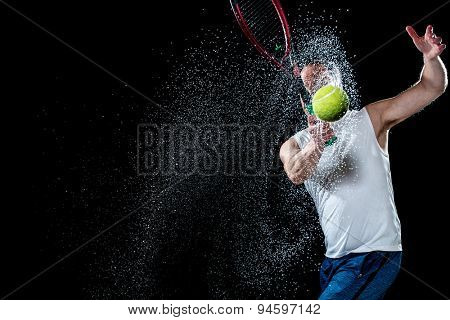 Tennis action shot. Forehand. Studio shot over black.