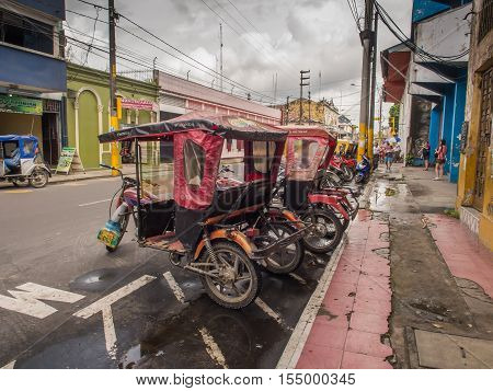 Rickshaws On A  Street