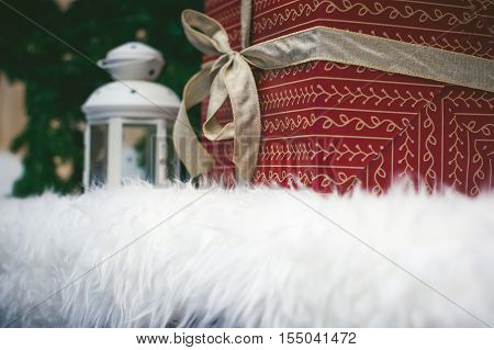 Big Gift Box Wrapped In Red Paper With A Decorative Festive Arnamentom, Perevyazanaya Ribbon And Bow