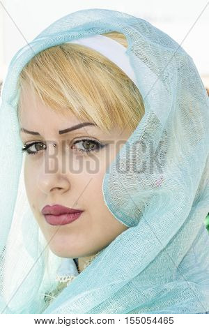 CAGLIARI ITALY - October 29 2016: Invitas waterfront Sardinia Port of performances and food traditions. - Portrait of a beautiful woman of free association Dolianova - Sardinia
