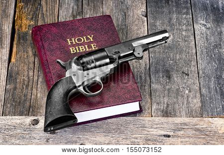 Old Western pistol on Holy Bible with room for your type.