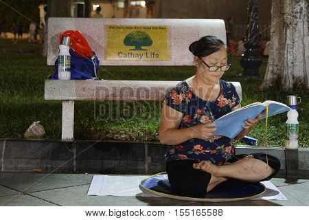 HANOI VIETNAM Octobre 23 2016 : Meditation at night on a place of Old Quarter of Hanoi. Hanoi is the capital of Vietnam and the country second largest city.