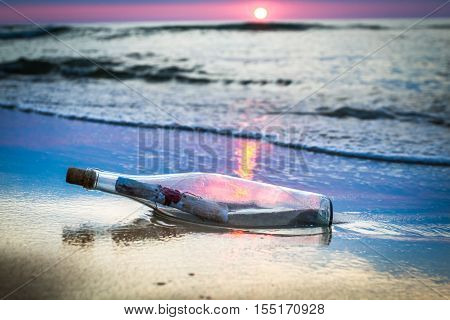 A Bottle With A Message Thrown By The Sea
