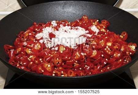 Adjika fresh grated red pepper and chili. . Red hot chilli pepper and ingredients for sauce.