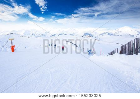 View to Tyrolian Alps and ski slopes in Austria from famous Kitzbuehel ski resort with 54 cable cars 170 km prepared skiing slopes and place of famous Hahnenkamm races.