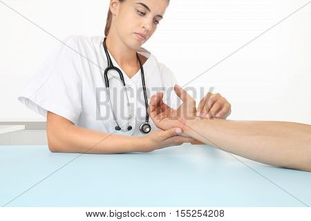 doctor measuring patient heart beat in medical office