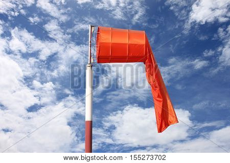Wind sock of equipment check the wind blow direction in day time on blue sky background.