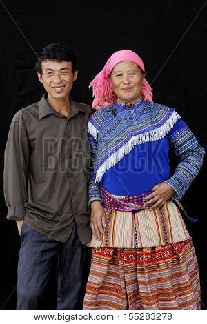Sin Cheng, Vietnam, October 26, 2016 : Couple In Front Of A Black Sheet. Hmong Women Of North Vietna