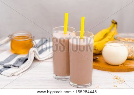 Milk shake with banana, oatmeal and honey, healthy breakfast