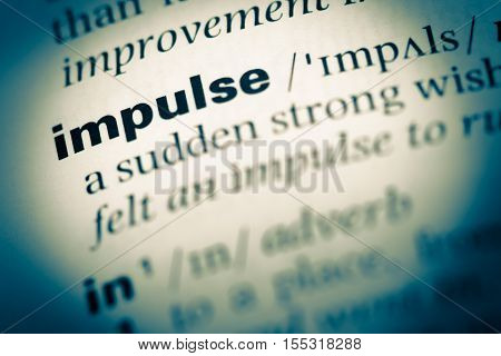 Close Up Of Old English Dictionary Page With Word Impulse