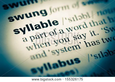 Close Up Of Old English Dictionary Page With Word Syllable