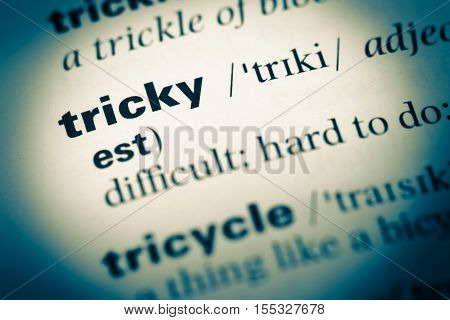 Close Up Of Old English Dictionary Page With Word Tricky