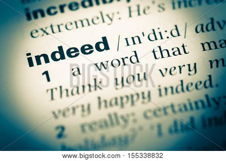 Close Up Of Old English Dictionary Page With Word Indeed