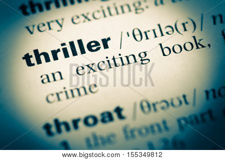 Close Up Of Old English Dictionary Page With Word Thriller