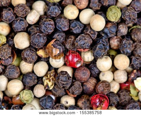 Horizontal background of colorful pepperorns close up
