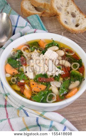 chicken soup with beans spinach tomatoes and other vegetables