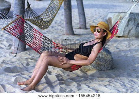 Lady relax sunshine in Ban Krut Beach at Prachuap Khirikhun Province Thailand