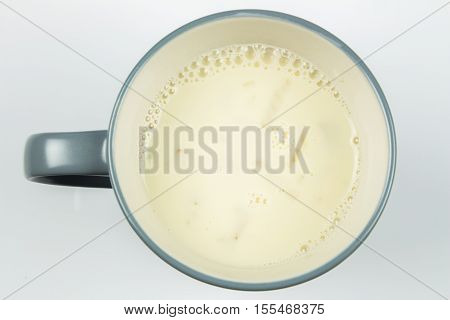 top view of glass milk. Glass of Milk From Above. Soybean milk. gray tone, Top view