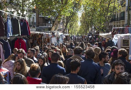 Madrid Spain - November 6 2016: Unidentified persons visiting Rastro street market. Popular open air flea market