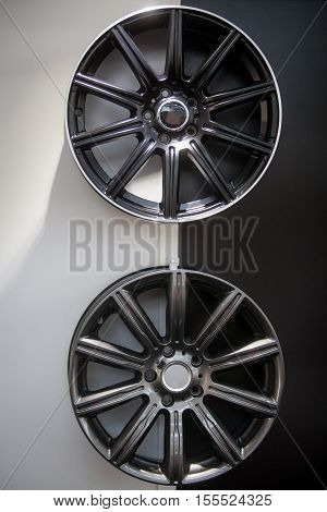 Close up shot of two new car rimms.