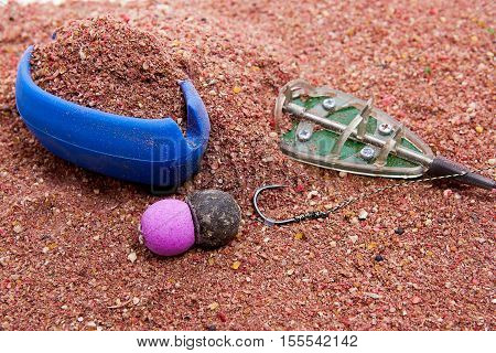 Dry Feed For Carp Fishing As Background. Ready For Use Carp Bait With Fishing Flat Feeder For Carp F
