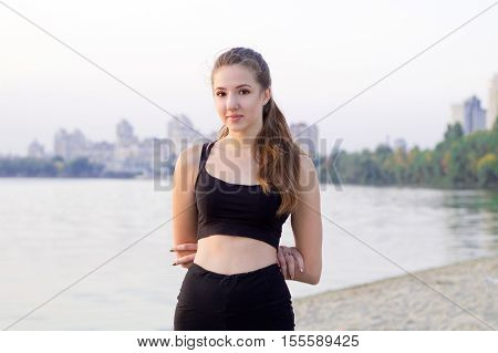 Young Woman Rests During Sport Training Exercises Outdoor In Morning