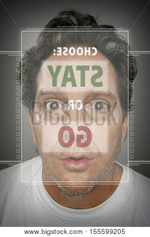 Dumbfounded Looking Man In Front of Touch Screen Deciding on Stay of Go.