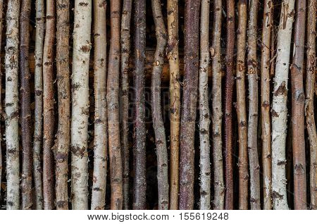 fence of wood with bark like a rustic background