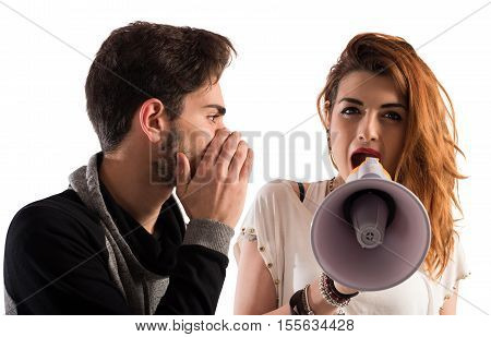 Man talking the ear of another girl with megaphone