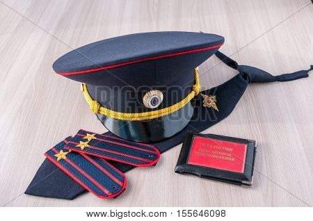 On the table lay a cap tie straps police lieutenant colonel and a pension certificate AMIA Russia