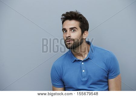 Creepy guy in blue polo shirt portrait