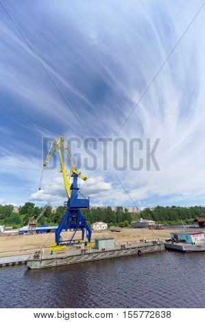 Gorodets, Russia. - June 2.2016. Blue Portal Crane With A Yellow Arrow On The Cargo Wharf In Gorodet