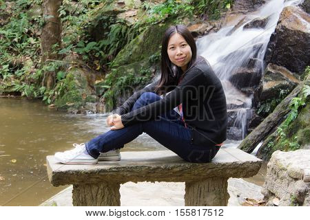 Thai woman with Mae Kam Pong waterfall, Chiangmai Thailand