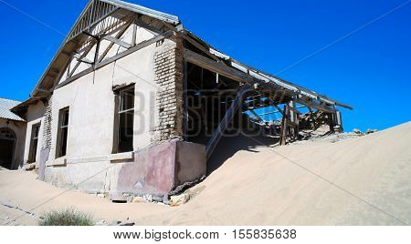 Kolmanskop ghost town sinking in sand sea Namibia