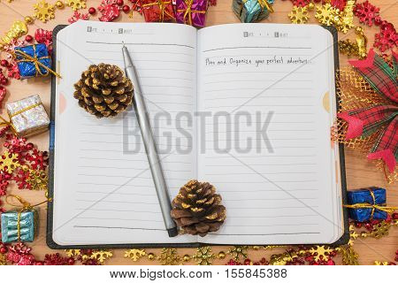 Notebook on a wooden table with Travel concept