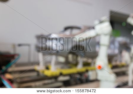 Abstract Blurred Background Interior Of Car Production Factory By Machine And Robot Automaton.