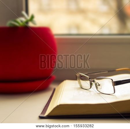 Glasses and books - classy attribute of intelligence