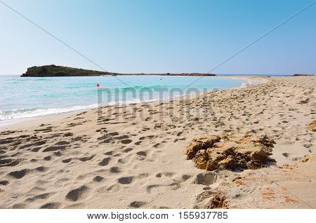 Lonely sea coast. Island surrounding deep blie water