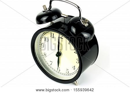 Alarm Clock on white showing six o'clock.